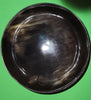 Polished buffalo horn bowl measuring 6" wide by 1 7/8" deep.
