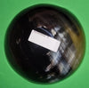 Polished buffalo horn bowl measuring 6" wide by 1 7/8" deep.