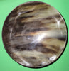Polished buffalo horn bowl measuring 7" wide by 2 to 2-1/4" deep.