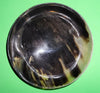 Polished buffalo horn bowl measuring 6" wide by 1 7/8" deep.