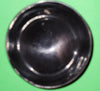 Polished buffalo horn bowl measuring 4" wide by 1 5/8" deep.