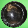 Polished buffalo horn bowl measuring 6" wide by 1 7/8" deep.