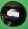 Polished buffalo horn bowl measuring 5" wide by 1 7/8" deep.