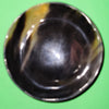 Polished buffalo horn bowl measuring 5" wide by 1 7/8" deep.