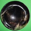 Polished buffalo horn bowl measuring 6" wide by 1 7/8" deep.