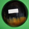 Polished buffalo horn bowl measuring 6" wide by 1 7/8" deep.