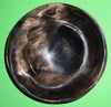 Polished buffalo horn bowl measuring 5" wide by 1 7/8" deep.