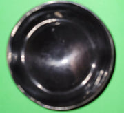 Polished buffalo horn bowl measuring 4" wide by 1 5/8" deep.