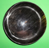 Polished buffalo horn bowl measuring 6" wide by 1 7/8" deep.