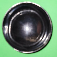 Polished buffalo horn bowl measuring 4" wide by 1 5/8" deep.
