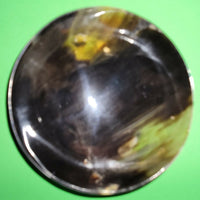 Polished buffalo horn bowl measuring 6" wide by 1 7/8" deep.