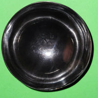Polished buffalo horn bowl measuring 4" wide by 1 5/8" deep.