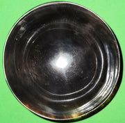 Polished buffalo horn bowl measuring 4" wide by 1 5/8" deep.