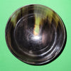 Polished buffalo horn bowl measuring 4" wide by 1 5/8" deep.